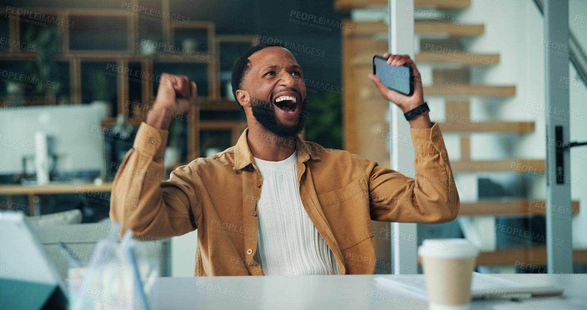 Buy stock photo Excited, man or celebration with phone in home office for stock market win, trading profit or good news. Freelance trader, black person and fist pump with smartphone at desk for investment revenue