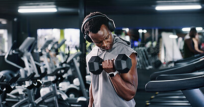 Buy stock photo Dumbbell, fitness and headphones with man in gym for bodybuilding, strength training or workout routine. Exercise, music and weightlifting with bodybuilder in health club for physical challenge
