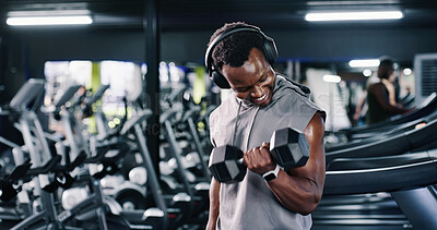 Buy stock photo Dumbbell, exercise and headphones with man in gym for bodybuilding, strength training or workout routine. Fitness, music and weightlifting with happy bodybuilder in health club for physical challenge