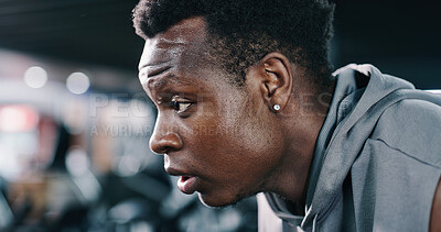 Buy stock photo Rest, tired and black man in gym for fitness, wellness and recovery from intense exercise. Sweat, fatigue and profile of person in workout club for break, health or breathing for challenge with bokeh
