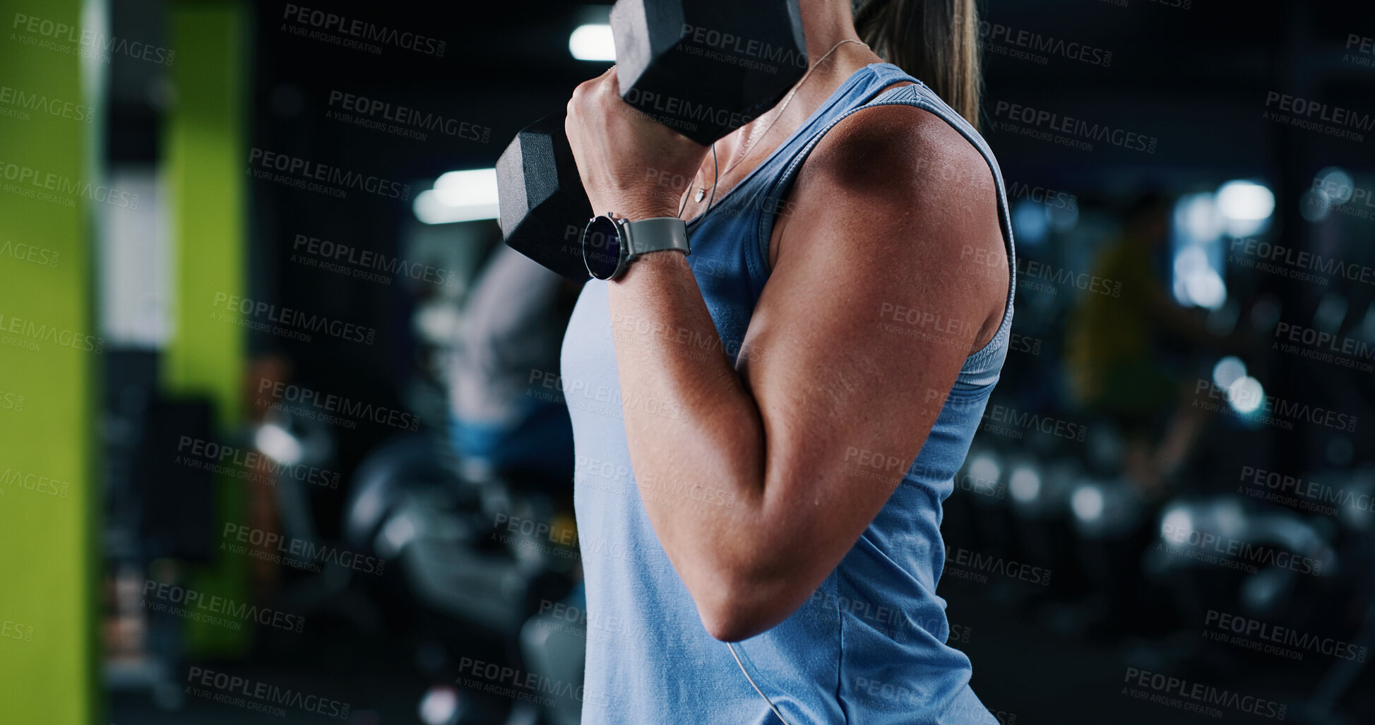 Buy stock photo Fitness, weightlifting or arm in center with dumbbell, power or bicep curl in bodybuilding. Exercise, bokeh or woman in gym with equipment, intense workout or strength in muscle gain routine.