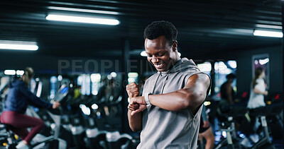 Buy stock photo Exercise, fist pump and time with man in gym for performance tracking, results or satisfaction. App, fitness and watch with excited person in health club for celebration or success as winner