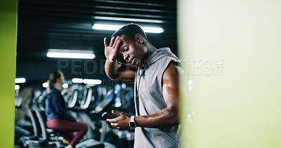 Buy stock photo Man, sweating and scroll in gym with phone, workout break and notification for social media update. Space, exhausted person and tech with exercise website, internet and alert for fitness app tracker.