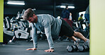 Fitness, plank and man in gym, exercise and routine to improve posture, bodybuilding or health goals. Bodybuilder, wellness and person with balance for metabolism boost and training for strength
