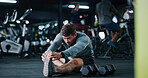 Man, stretching or fitness with workout preparation for exercise or indoor training in gym. Active, male person or getting ready with warm up, dumbbells or flexibility for wellness in health club