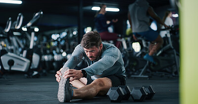 Buy stock photo Man, stretching or fitness with workout preparation for exercise or indoor training in gym. Active, male person or getting ready with warm up, dumbbells or flexibility for wellness in health club