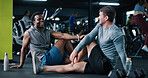 Friends, laugh and talk in gym with stretching, start workout and exercise joke for bonding together. People, discussion and warm up in health club with humor, fitness and getting ready for training.