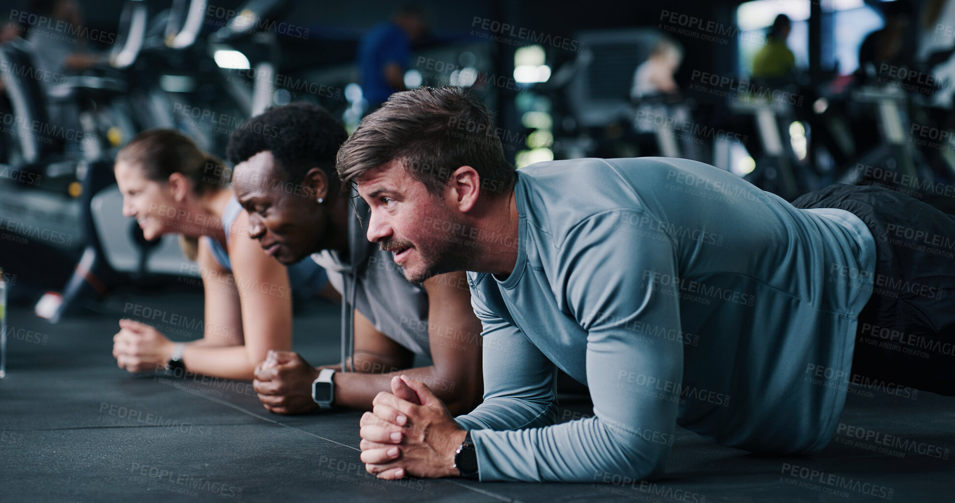 Buy stock photo Fitness, plank and group in gym, exercise or routine to improve posture, instructor and bodybuilding. Wellness, personal trainer and people with balance for metabolism boost and training for strength