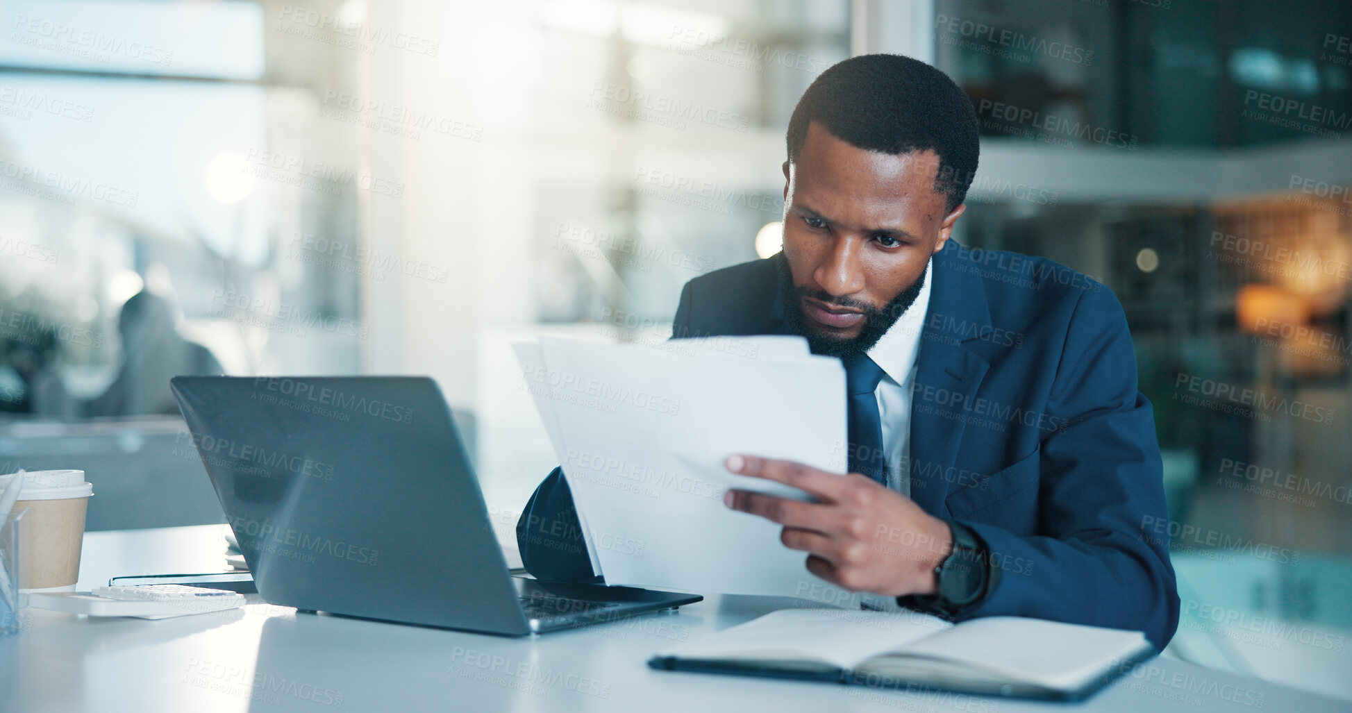 Buy stock photo Investor, laptop and black man with documents, reading and checklist for company audit. African person, trading strategy and financial advisor in office, pc and research for stock market and planning