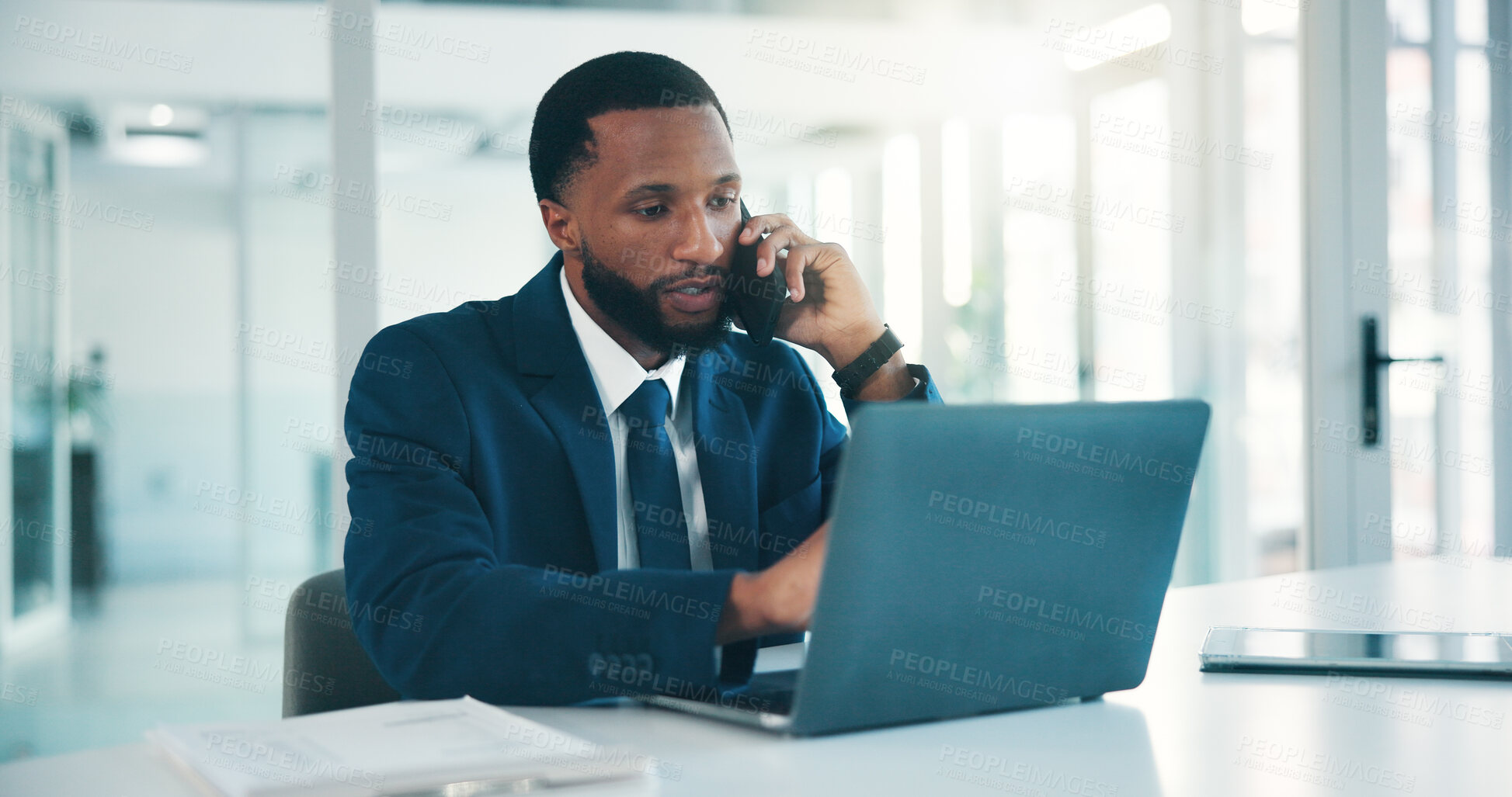 Buy stock photo Office, phone call and man with laptop, serious and discussion for financial advice or consultation. Business, wealth management and black person with mobile for chat, online and research with tech