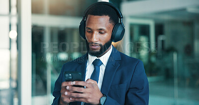 Buy stock photo Financial advisor, smartphone and black man in office, headphones or podcast for trading info. African person, employee or investor in workplace, cellphone or audio for radio or digital app for sound