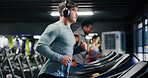 Gym, runner or man with headphones on treadmill for fitness, streaming music or cardio workout for health. Performance, exercise machine or athlete with audio tech to listen, training album or active