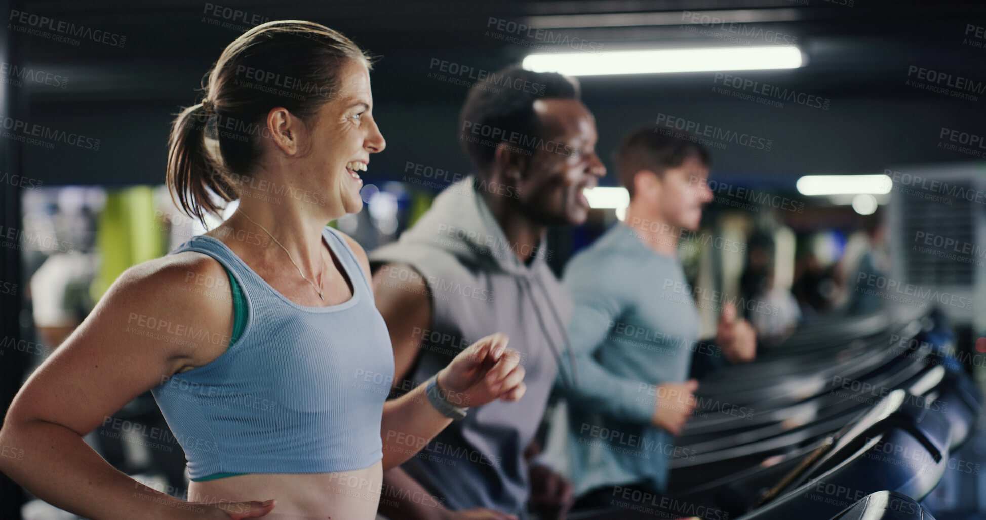 Buy stock photo Running, training and woman laugh on treadmill in gym, workout and endurance for fitness joke. Cardio machine, funny person and exercise club for sports, energy and practice for wellness with friends