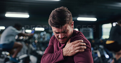 Buy stock photo Athlete, man and ache with shoulder pain at gym of fitness injury, muscle fatigue and burnout. Male person, strain and pressure from fibromyalgia, physical discomfort and tendinitis with joint cramps