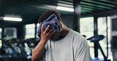 Buy stock photo Tired, man and towel in gym with sweat, finish exercise and complete cardio workout for recovery. Exhausted, person and stop fitness challenge in health club with fatigue, wellness and wipe face.