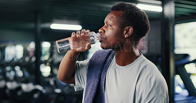 Buy stock photo Black man, fitness and drinking with water bottle in gym for hydration, recovery or workout rest. Active, male person or mineral liquid with beverage for sustainability or nutrition in health club