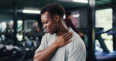 Buy stock photo Man, discomfort and ache of shoulder pain at gym from fitness injury, muscle fatigue and burnout. Male person, inflammation and strain of fibromyalgia, herniated disc and tendinitis with joint cramps