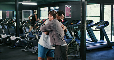Buy stock photo Happy, men and friends in gym, hug and celebration with personal trainer for health goals or fitness. People, embrace and instructor with smile for workout milestone, athlete and support for wellness
