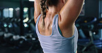 Back, fitness and weightlifting with woman in gym for strength training or workout routine. Bodybuilding, exercise and space with person in health club for challenge, effort or physical improvement