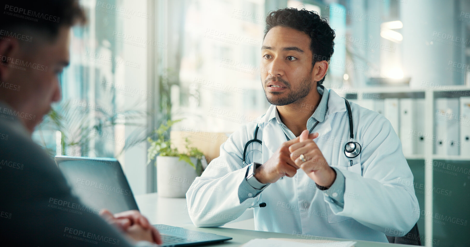 Buy stock photo Men, doctor and explain with advice at hospital, listen and laptop for wellness report in consultation room. People, medical professional and patient with discussion for healthcare in clinic office