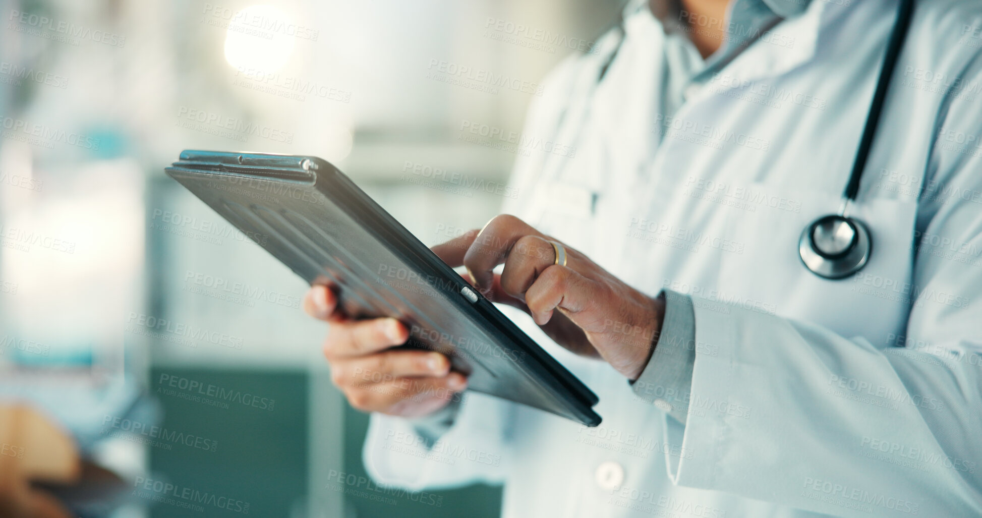Buy stock photo Hands, doctor and typing with tablet at hospital, scroll and check schedule for telehealth in office. Person, medical professional and click with tech, application or virtual consultation at clinic