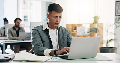 Buy stock photo Man, laptop and typing at startup with documents, review proposal and coworking at media company. Person, writer and computer with insight, notes or project management for report at creative agency