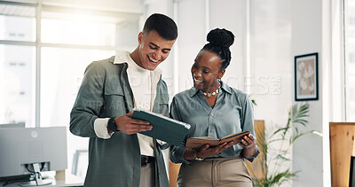 Buy stock photo Happy man, woman and tablet with notebook, team and approval with project management at media company. People, talk and tech with app, deal and feedback for proposal at startup creative agency