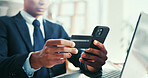 Hands, credit card and laptop at office with smartphone, investment and fintech for easy payment. Person, computer and broker with online shopping, bills and scroll on mobile app at financial agency