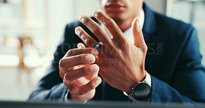 Buy stock photo Divorce, wedding ring and hands of businessman in office for relationship problem, conflict and stress. Thinking, sadness and person with jewelry for marriage crisis, mistake and separation at work