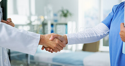 Buy stock photo Team, doctors and shaking hands at clinic, welcome or agreement with healthcare services job. People, handshake and deal with motivation for success, achievement or goals with promotion at hospital