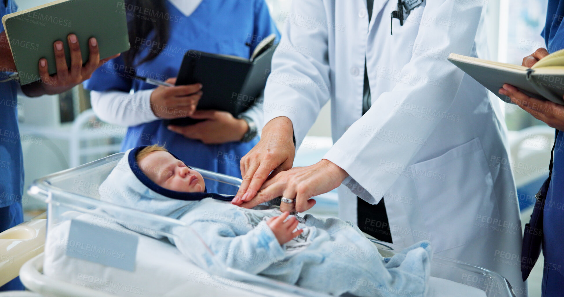 Buy stock photo Hands, nurses and doctor with CPR training on baby doll for medical simulation, life saving or notes. People, health interns or expert with mannequin in clinic for infant chest compressions or skills