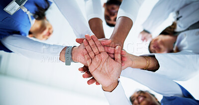 Buy stock photo Doctors, team and stack hands in circle at hospital with support, motivation and celebration for goals. People, medical professional and group with low angle, synergy or healthcare services at clinic