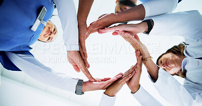 Buy stock photo Hospital, doctors and people with unity, circle and collaboration for medical services or healthcare. Clinic, health workers and group with solidarity, low angle and support to help and community