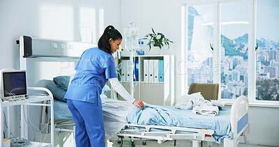 Buy stock photo Making, bed and woman in hospital, nurse and blanket change for hygiene, medical services and health. Clinic, healthcare worker and person with sheets, tidy and cleaning for rehabilitation or healing