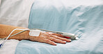 Hand, hospital bed and oximeter for recovery, finger and check pulse with healthcare services. Elderly person, medical equipment and monitor for cardiology, assessment and rehabilitation at clinic