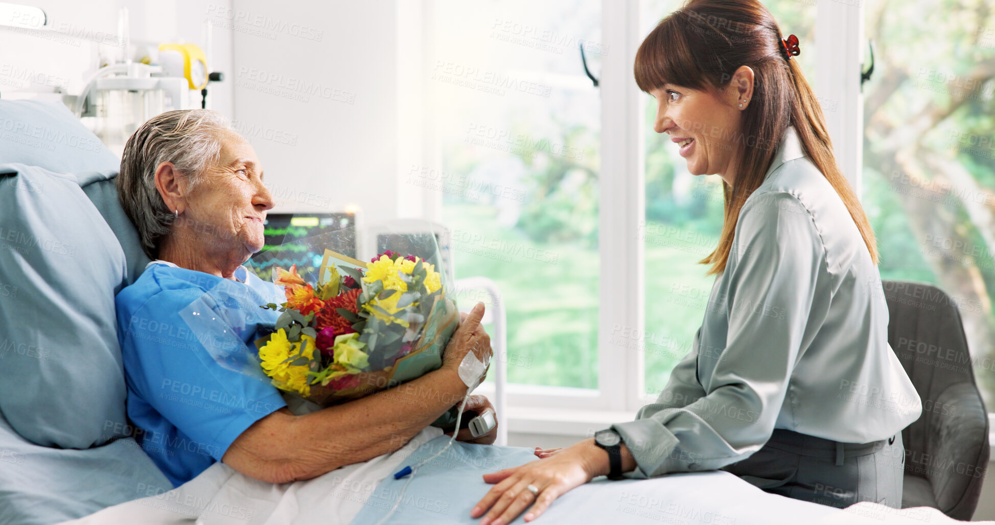 Buy stock photo Hospital bed, flowers and woman with senior mother for support, comforting and gift for surgery recovery. Healthcare, family and person with bouquet for elderly patient for healing, wellness and love