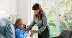 Senior woman, daughter and holding hands in hospital bed for visit, support and comfort for recovery. Elderly patient, person and empathy for chronic illness, medical services or healthcare operation