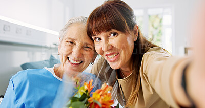 Buy stock photo Selfie, smile and senior mother with daughter in hospital for love, flowers and rehabilitation visit. Photography, support and medical patient with portrait of people in clinic for hug and bouquet