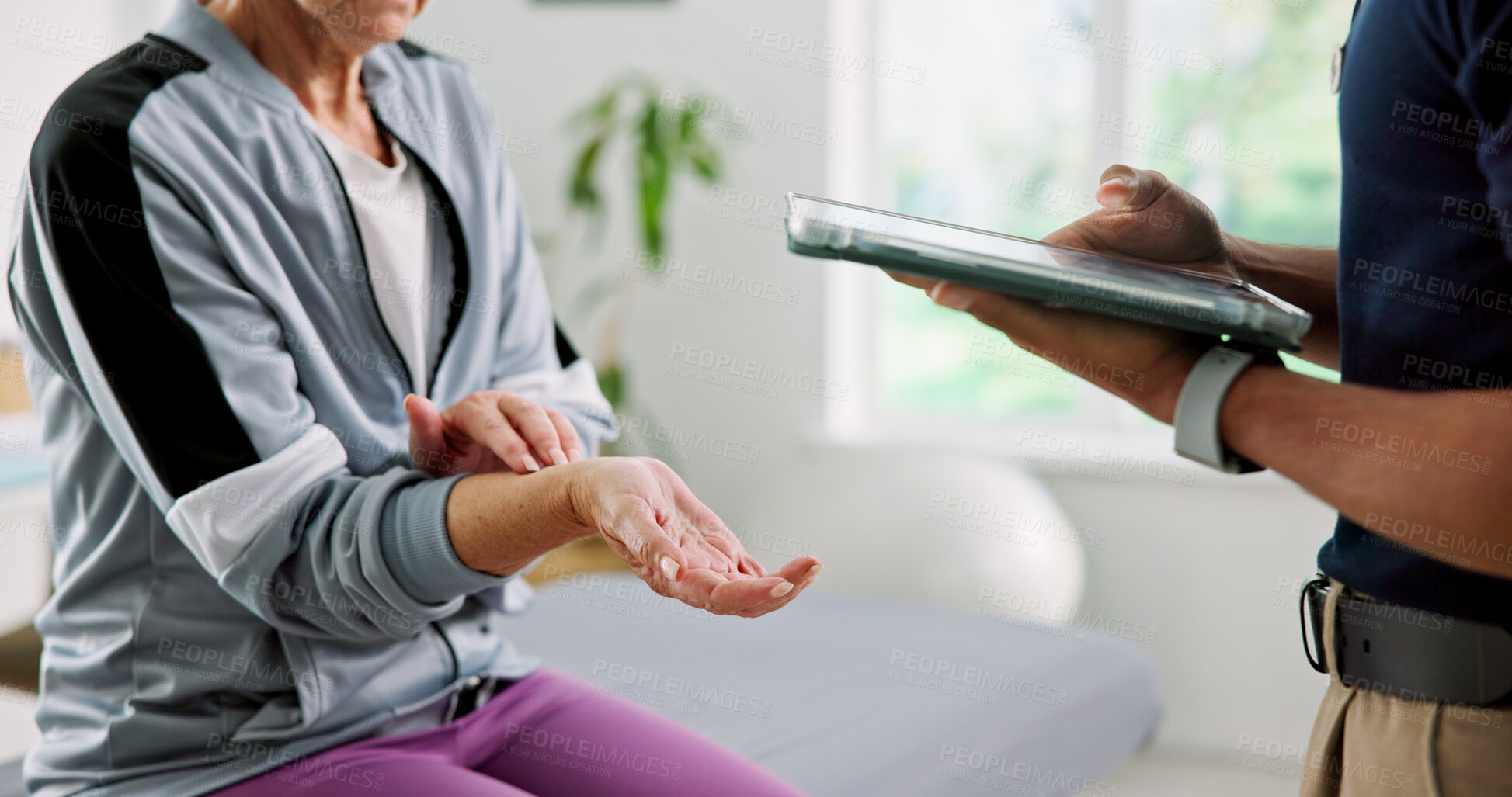 Buy stock photo Physiotherapy, tablet and wrist pain with old woman in clinic for joint injury, rehabilitation and discussion. Online report, physical therapy progress and advice with people for osteoarthritis
