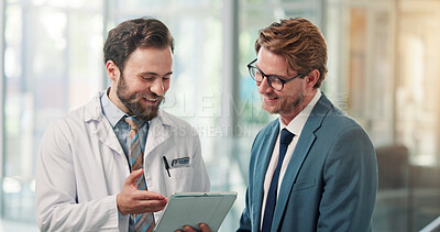 Buy stock photo Doctors, men and tablet with discussion at clinic, insight and review with proposal in lobby. People, hospital director and team with tech, app and checklist with report for healthcare services
