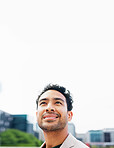 Future, opportunity and sky with business man in city for career ambition or development. Space, thinking and vision with happy corporate employee outdoor in urban town for commute or travel