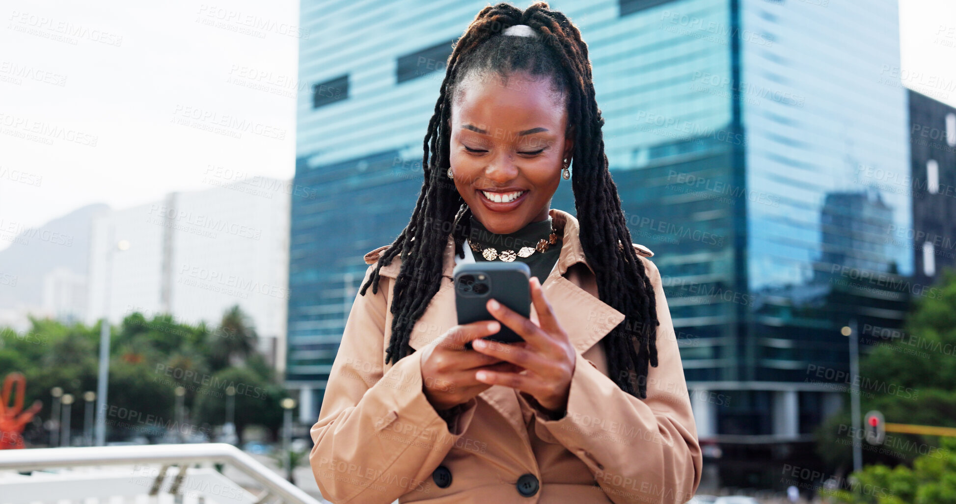 Buy stock photo Real estate, smile and black woman in city, smartphone and typing with commute, opportunity and internet. Excited, realtor or African person with cellphone, network or email for property investment