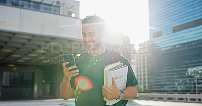 Buy stock photo Phone, college student and man in city with books, flare and check schedule with course on commute. University, mobile and happy person in town with textbooks for education, learning app and travel
