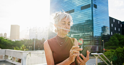 Buy stock photo Mature, happy woman and city with phone for network, communication or online research. Female person, business and typing with mobile smartphone or flare for company app or connectivity in urban town