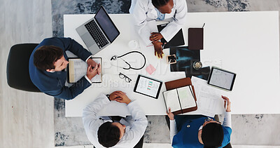 Buy stock photo Businessman, doctors and meeting with notes in clinic for surgery funding, action plan or feedback. Paperwork, people and medical team with tech for resource allocation, hospital management and above