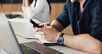 Man, hands and typing in office with phone, text message and laptop for social media marketing campaign. Creative, person and coworking with computer, tech and notification for digital advertising.
