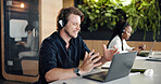 Call center, laptop or man in hybrid office with headset, contact us or aid in crm service. Professional, coworking or consultant in agency with tech, online assistance or feedback in client support