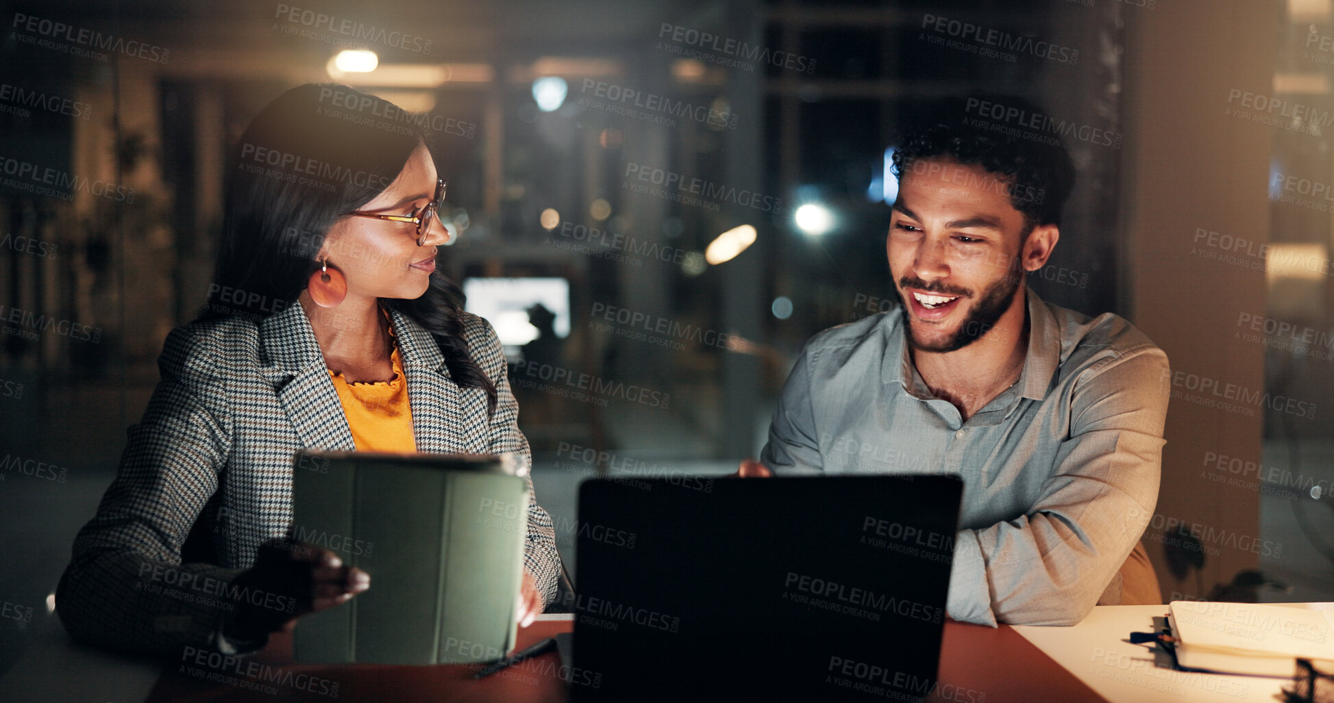 Buy stock photo Tech, conversation and business people in office at night with creative project in collaboration. Feedback, laptop and manager with magazine editors for advice, publishing deadline or tablet article