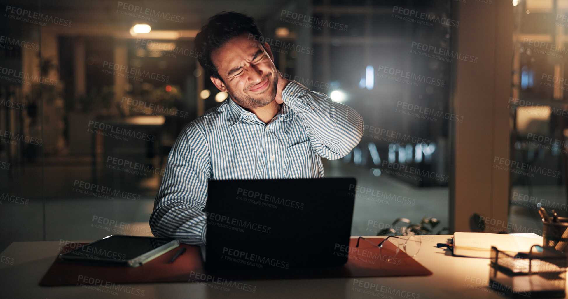 Buy stock photo Neck pain, businessman and night in office on laptop for finance review, deadline or research. Strain, working late and person on computer with fatigue, exhausted and muscle ache for financial report