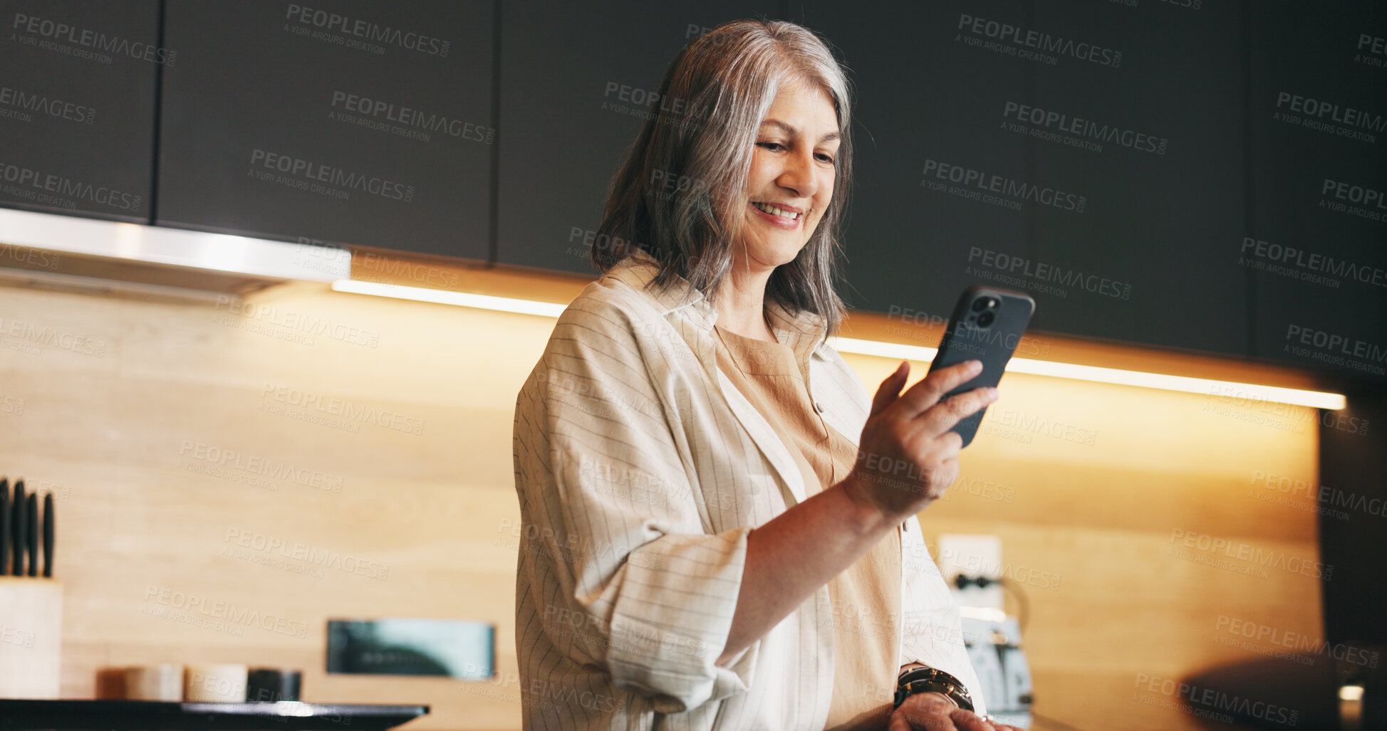 Buy stock photo Home, cellphone or woman in kitchen, typing or message to contact, texting or email. Apartment, connection or mature person with smartphone, internet or digital app for social media or online reading